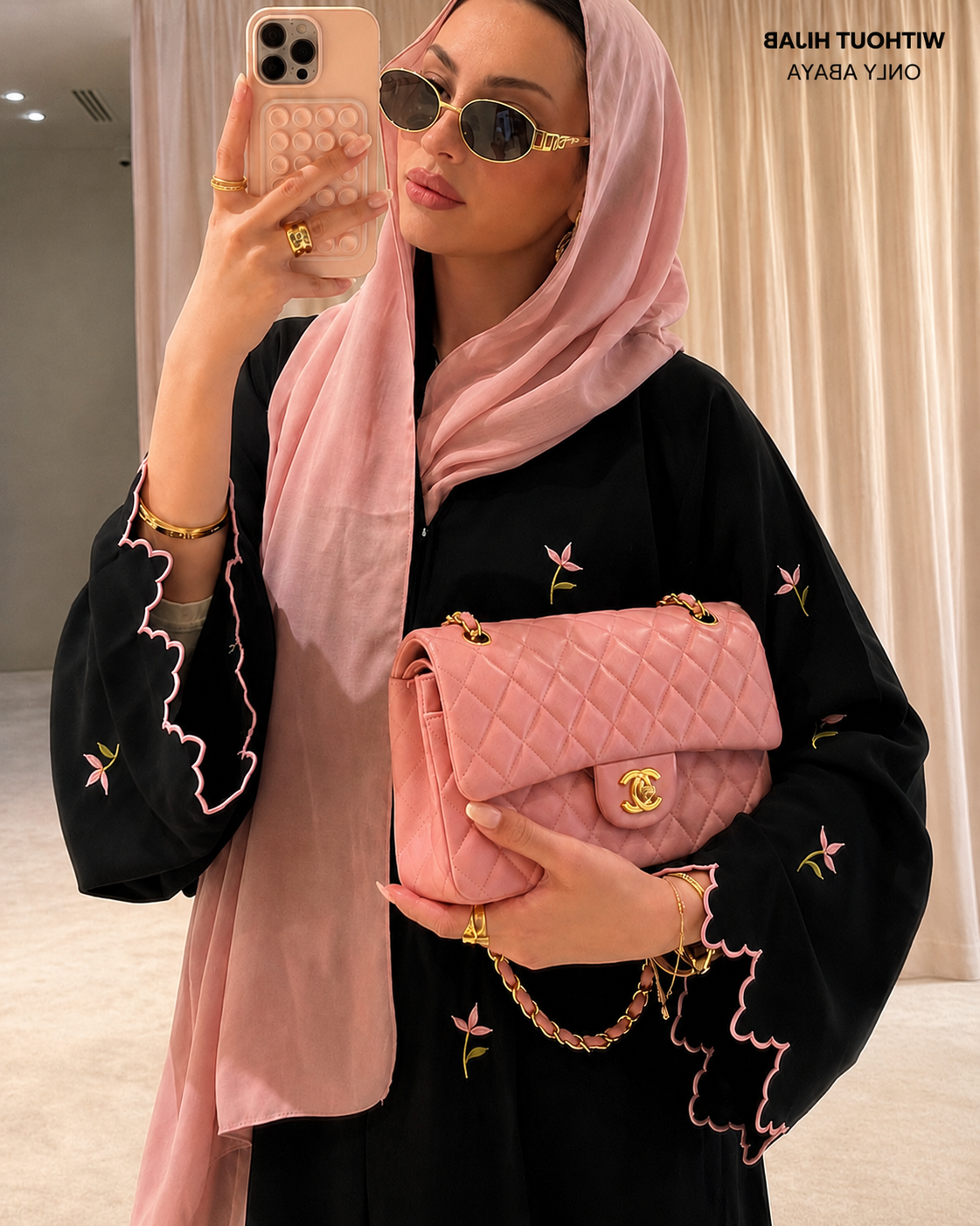 Black abaya with pink floral embroidery and cutwork, model front view