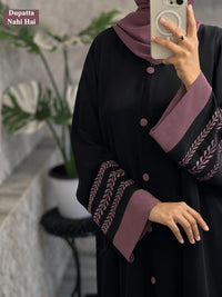 Black abaya with mauve embroidered sleeves and buttons