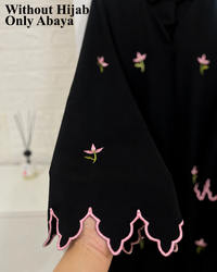 Black abaya sleeve with pink floral embroidery and scalloped cutwork cuff