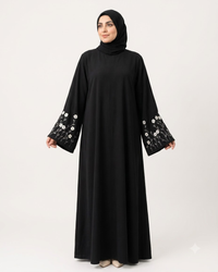 Close view of white floral embroidery on black Firdous abaya - Aizel Abaya
