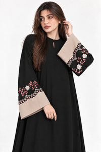 Black abaya side pose with matching floral kangoora embroidered cuffs